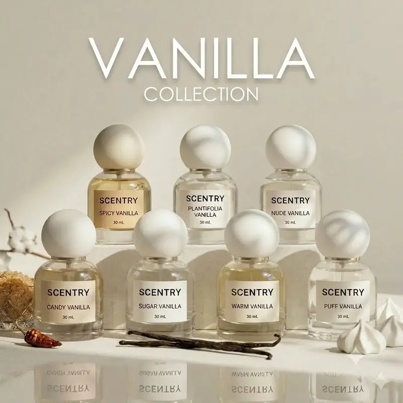 น้ำหอม Scentry Vanilla Collection ครบ 7 กลิ่น ขวดแก้วใสฝาทรงกลมสีขาวเรียงสองแถวบนโต๊ะขาว มีฝักวานิลลาและดอกฝ้ายประกอบฉาก